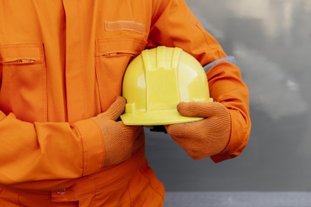 front-view-worker-uniform-holding-hard-hat.jpg
